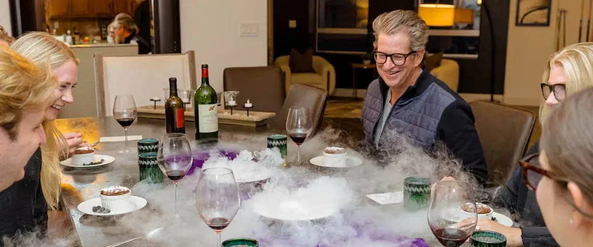 Guests enjoying a private chef dinner at a Colorado Airbnb