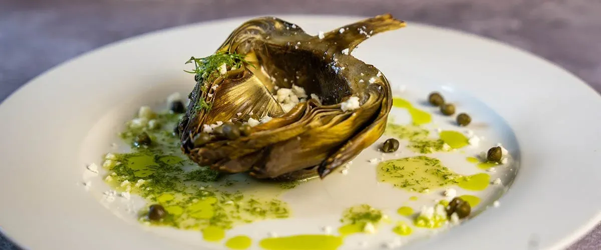 Roasted artichoke course prepared by Chef Roilty