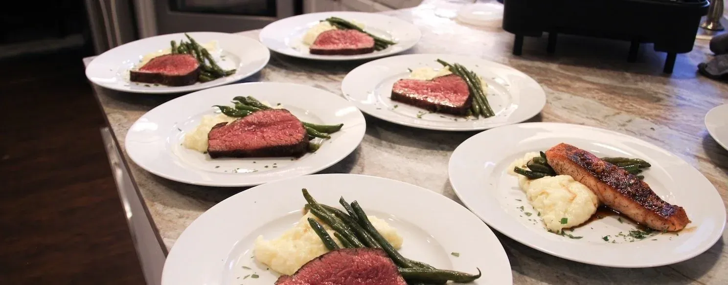 Plated steak course for a birthday dinner