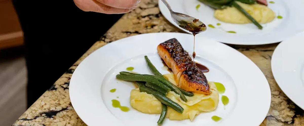 Honey soy glazed salmon plated by a private chef in Denver